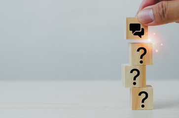 Q and A concept. Q and A symbols on wooden cube blocks on a grey background. Illustration for...