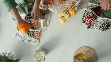 Overhead shot of hands laying ingredients out on the counter in 4K, showing organized meal prep, fresh components, culinary setup, and professional kitchen preparation for cooking visuals.