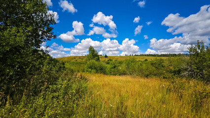 Hills with meadows and forests.