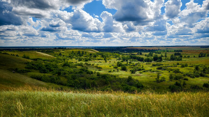 Hills with meadows and forests.