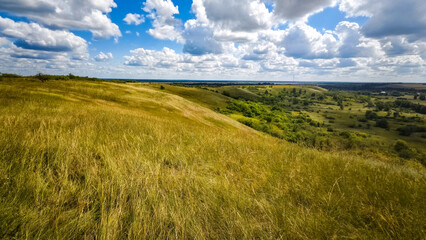Hills with meadows and forests.