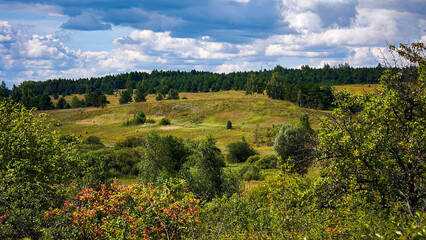 Hills with meadows and forests.