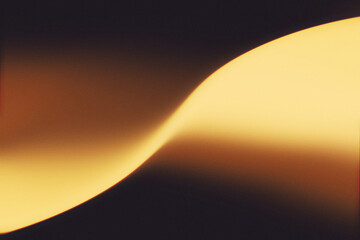 Golden amber and warm glow grainy gradient blur background. Cinematic luxury abstract background.