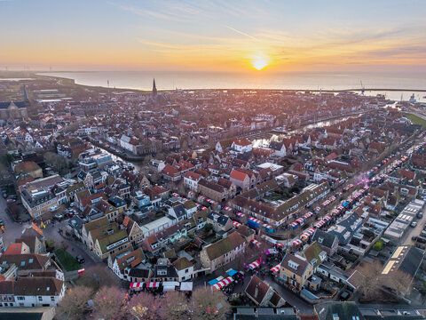 Aerial drone view of Harlingen coastline and harbour at sunset