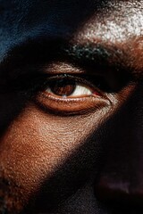 A model's penetrating gaze amidst shadows