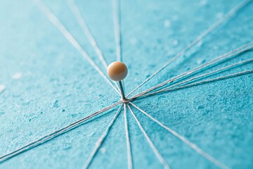 Pin connected by threads with a blue background