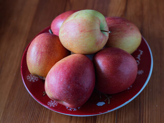 Fresh Red and Green Apples on a Decorative X-Mas Plate