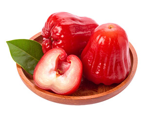 Fresh rose apples with green leaves arranged on a wooden plate showcasing their vibrant red color and unique shape