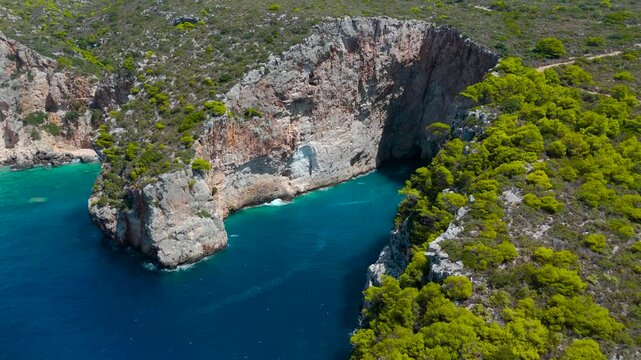 4K Aerial View of Zakynthos Greece Alitzerini Cave and Dramatic Coastal Cliffs with Turquoise Ionian Sea Waters