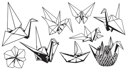 Assorted origami cranes and floral shapes arranged as decorative papercraft display.
