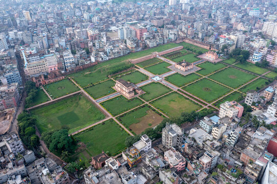 Aerial view of Lalbagh Fort's expansive green lawns and Mughal architecture contrasting with the dense urban sprawl, Dhaka, Dhaka Division, Bangladesh.