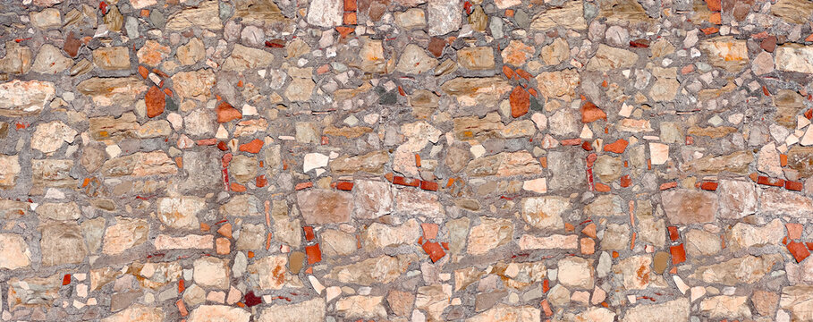 Old stone wall surface with varying textures