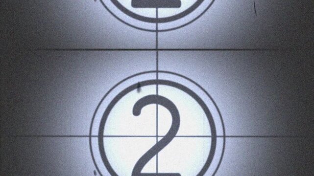 5 second Old film countdown. Rolling old film countdown with dust and scratches effect. 4k video.