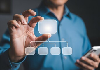 Man holding a digital flowchart in his hand with a smartphone in the other hand close up