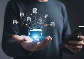 Man holding a folder icon with documents flowing out while holding a tablet in the other hand