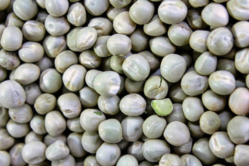 A close up of a bunch of small white peas