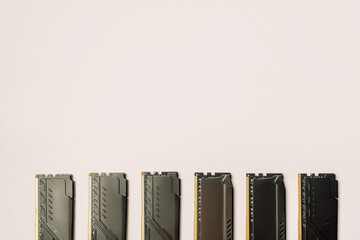 Row of black RAM sticks on white background, minimal tech concept. High quality photo