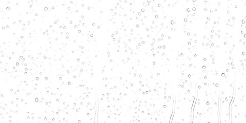 A high key minimalist pattern of fine raindrops on a glass windowpane