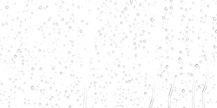A high key minimalist pattern of fine raindrops on a glass windowpane