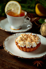 Meringue lemon tart and cup of tea.