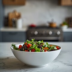 A close-up of a bowl of fresh green salad on a wooden table in a modern kitchen interior. Concepts of healthy eating, healthy lifestyle, home cooking and well-being, and post-holiday diet.