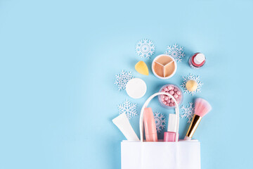 Winter makeup cosmetics, natural minimal make up set. Various makeup cosmetics - shadows, lipstick,...