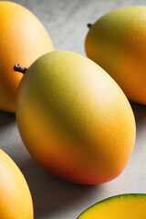 Ripe mango on white surface. Fresh fruit  