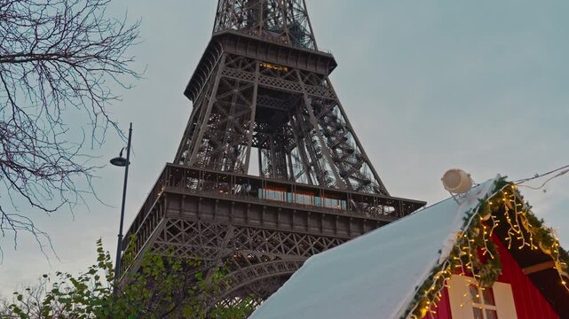 Paris, France - 10.12.2022 : Christmas market near Eiffel Tower. Crowd of people