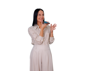 Cheerful young woman recording or playing a voice message on her mobile phone, actively engaged in modern communication