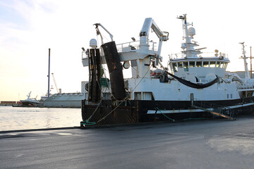 A vibrant and picturesque scene of traditional fishing boats moored in a Chilean coastal harbor