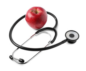 Ripe apple and stethoscope isolated on white