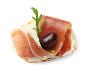 Delicious bruschetta with cream cheese, prosciutto, marinated black olive and arugula isolated on white, top view