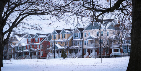 Naklejka premium Snow in a New England village, a tranquil nostalgic winter landscape.