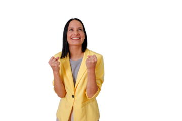 Happy young woman celebrating victory, triumph, and success with clenched fists, feeling excited and looking up, transparent background