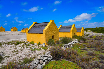 Historic red Slave Huts (Slave Houses) on the Salt Flats Coast of Bonaire in the Dutch Caribbean