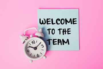 Welcome to the Team: text on a sticky note. Greeting New Team Members, Perfect for Onboarding, Corporate Culture, Employee Orientation, Team Building Events.