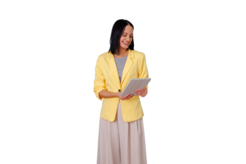 Young businesswoman with dark hair holding a touchscreen tablet, looking down and smiling. Professional working in business casual outfit