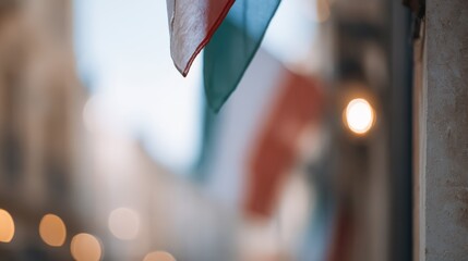 Italian flag waving in a blurry street background