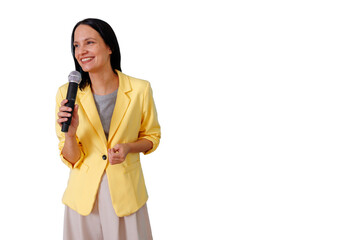 Woman in yellow blazer speaking into microphone, presenting at an event, smiling for public speaking and communication
