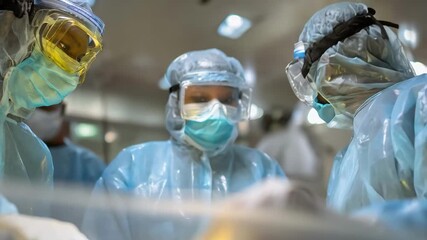 Veterinary staff in medium shot wearing protective gear managing biological waste from animal treatments with emphasis on hygiene and containment procedures.