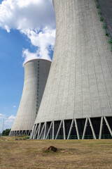 Cooling towers at nuclear power plant, energy self-sufficiency, greenhouse emission reduction and global warming concept