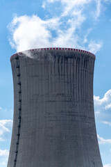 Cooling towers at nuclear power plant, energy self-sufficiency, greenhouse emission reduction and global warming concept