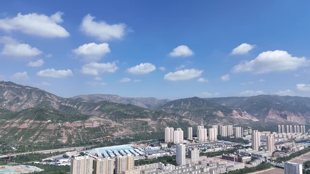 Xining City Aerial Skyline Shot with Mountains and Blue Sky
