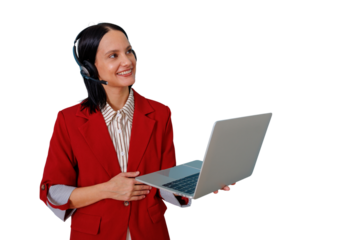 Employee in red jacket wearing headset and holding laptop, providing customer service and technical support with a smile
