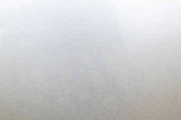 Textured surface with subtle variations in color and pattern observed in a natural setting during daylight