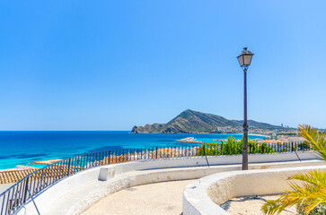 Fototapeta premium Altea old town aerial view with typical white houses buildings, Altea bay Mediterranean Sea azure water, mountain Sierra Helada park, Altea city centre, Alicante province, Valencian Community, Spain
