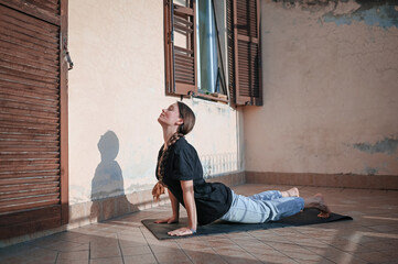 Young woman practicing yoga during serene morning routine