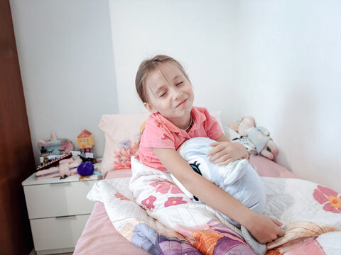 Child's cozy morning in a bright bedroom