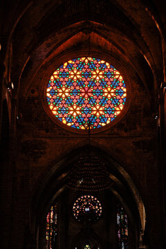 Vibrant rose window illuminating historic cathedral interior