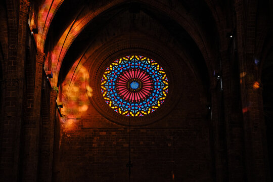 Palma Cathedral rose window creating colorful light patterns